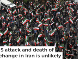 A group of demonstrators in Tehran wave Iranian flags in support of the government on Feb. 28, 2026. AP Photo/Vahid Salemi